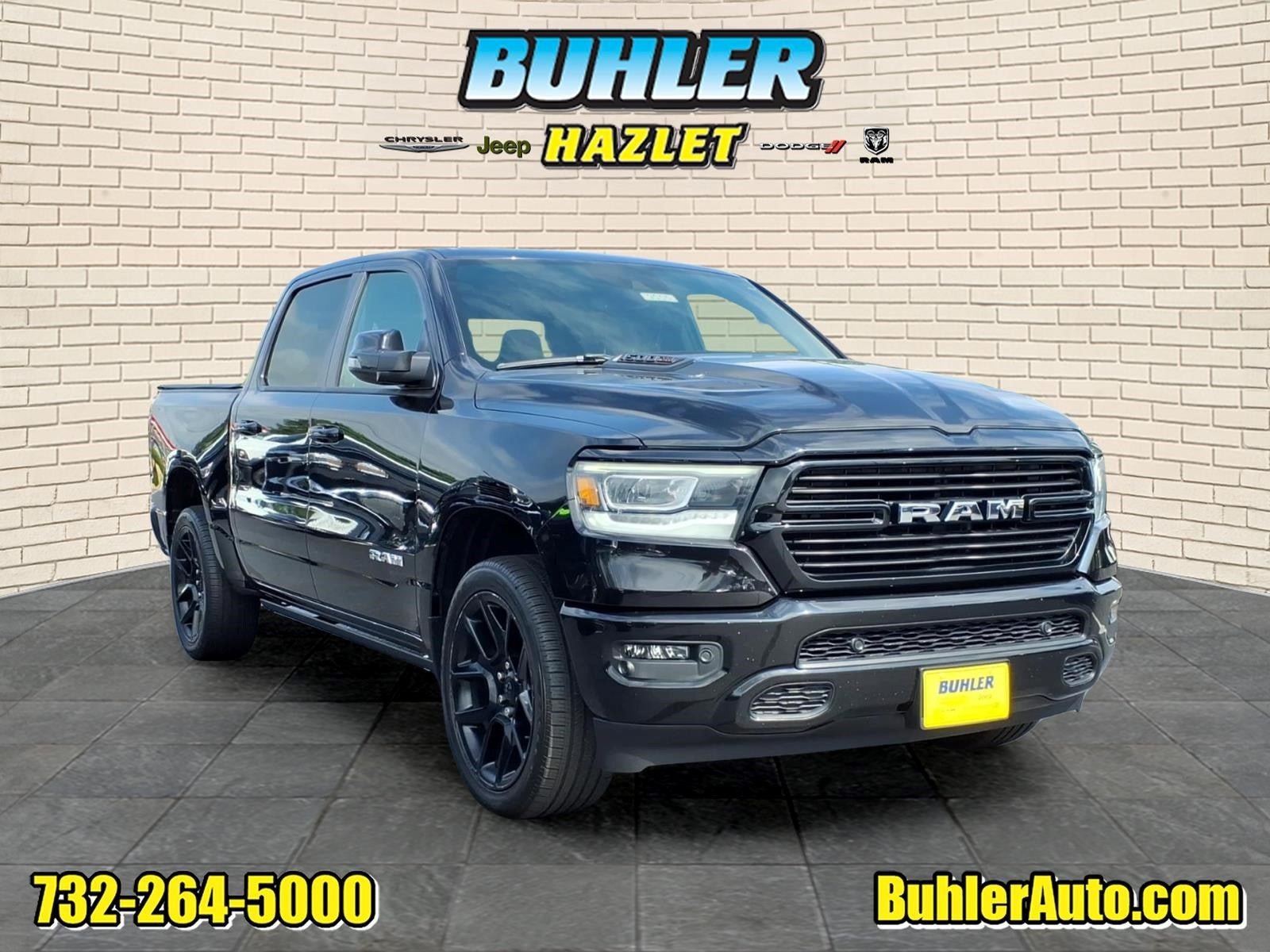 2023 RAM 1500 Laramie Crew Cab 4x4 5'7' Box in Diamond Black Crystal Pearlcoat — front three-quarter view