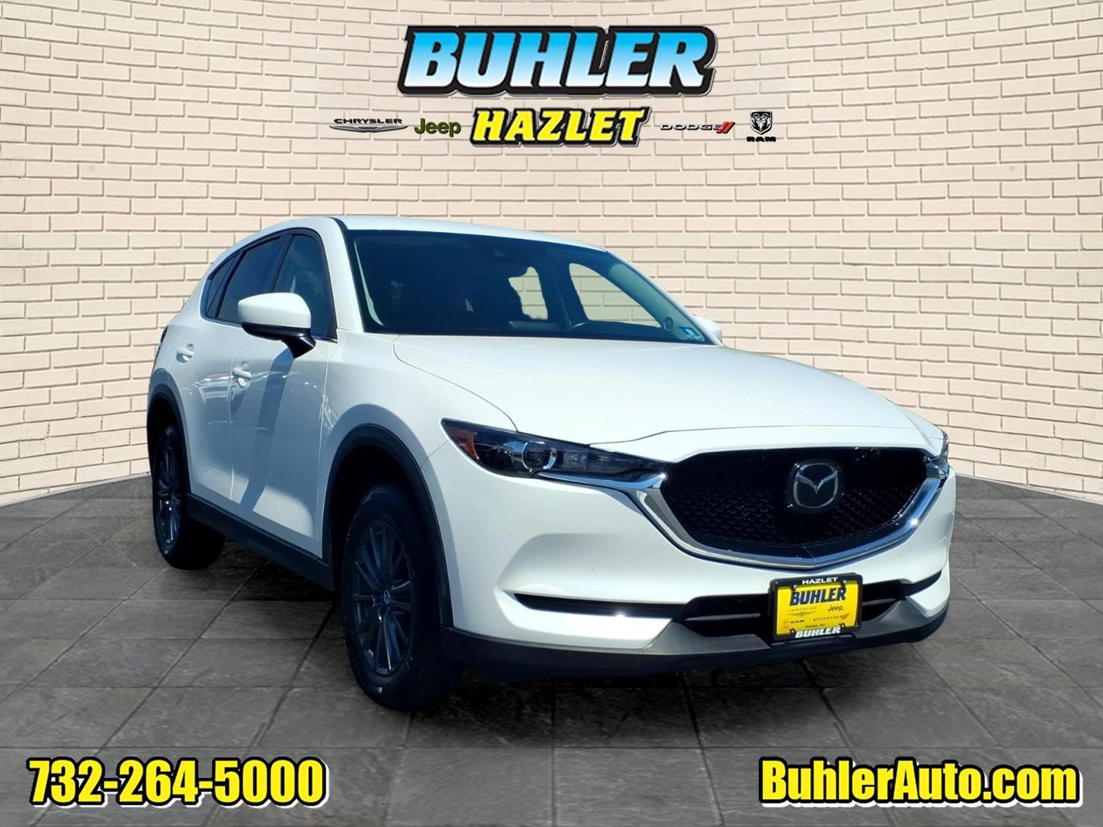 2020 Mazda Mazda CX-5 Touring in Snowflake White Pearl Mica — front three-quarter view